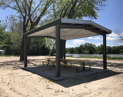 Picnic table awning by lake