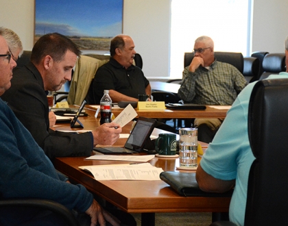 Committee members sitting around table