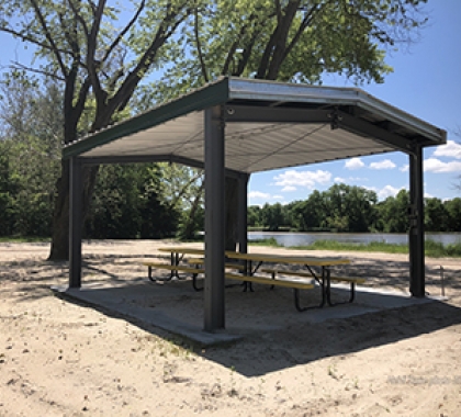 Picnic table awning by lake