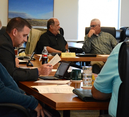 Committee members sitting around table