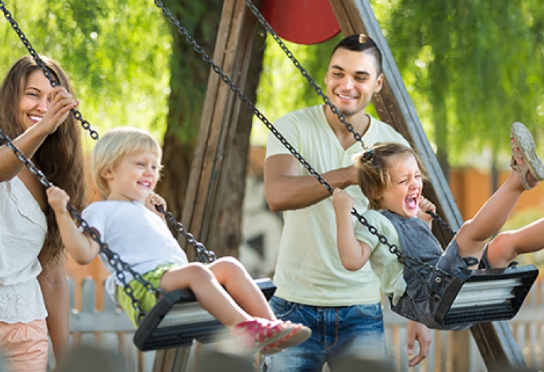 Two girls on playground swings